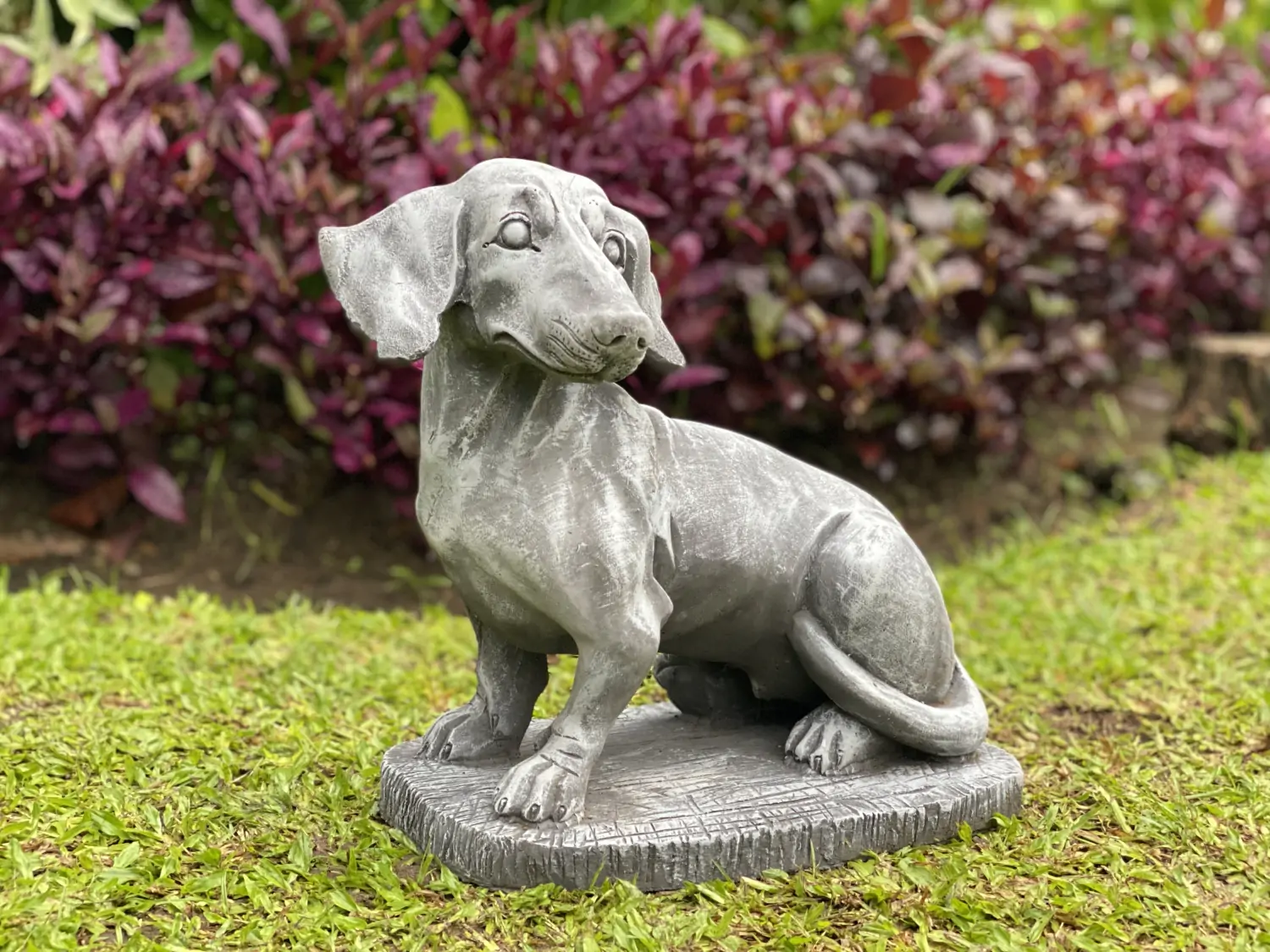  Product image 1 of the product “Timber - Dachshund sitting on base, 35cm L | cast stone ”
